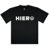 The Hiero Bold Heavy Tee by Hieroglyphics is a black T-shirt with "HIERO" in bold white letters on the chest, inspired by hip-hop culture. It features a face-like white circle with three lines and two dots, round neckline, and short sleeves against a white background.