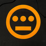 Detailed close up of black hoodie with yellow Hieroglyphics hip-hop logo on the chest and Champion logo on the sleeve.