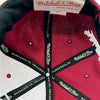 Detailed close up of Mitchell & Ness taping inside crown of Cardinal red Hiero x Mitchell & Ness Hat.